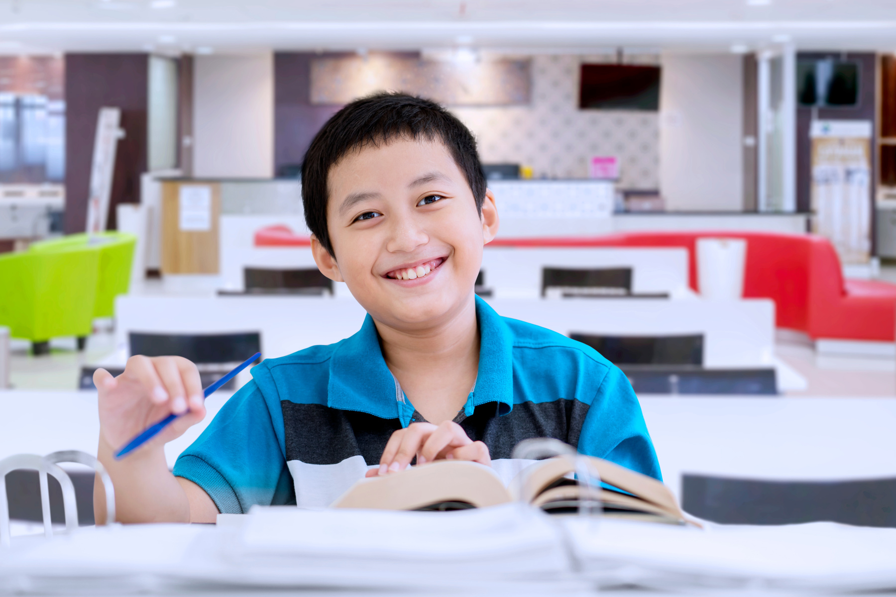 Asian Preteen Boy Doing Schoolwork